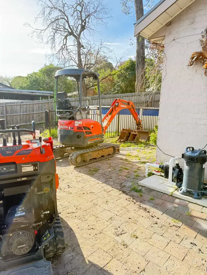 Excavator loading tipper on Melbourne site